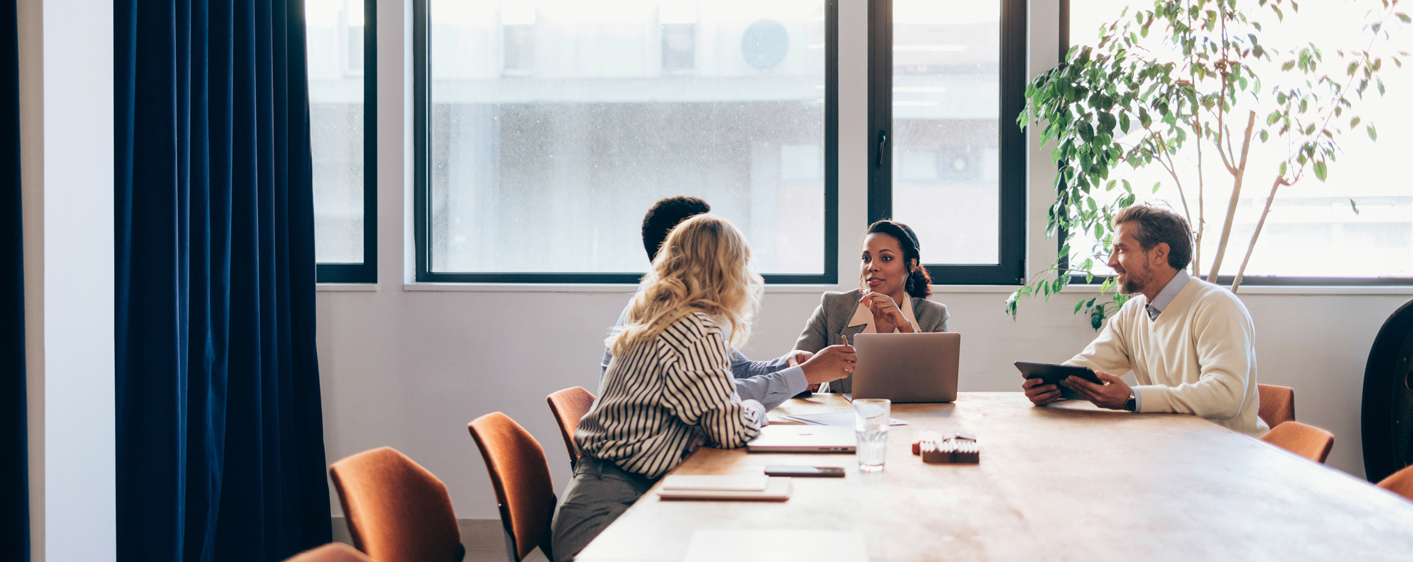 Group of people having a discussion in a business setting
